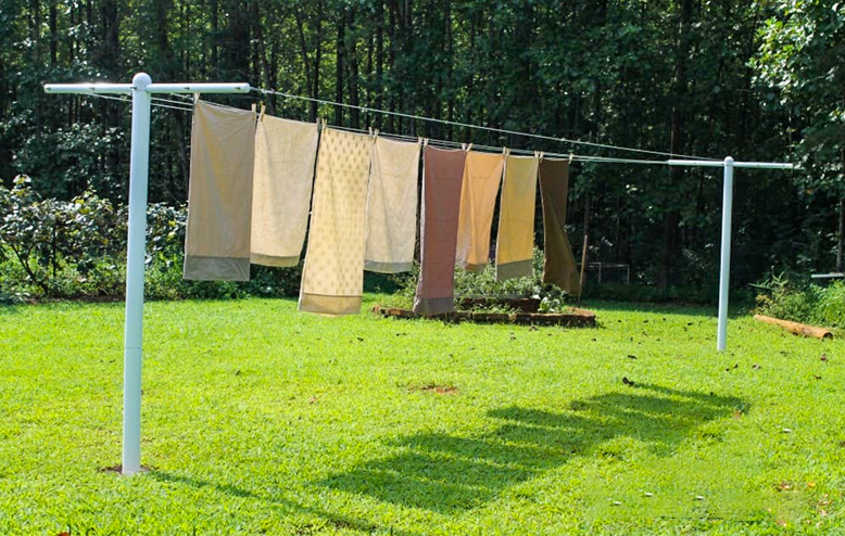 Installation poteau corde a linge sur pieux vissés