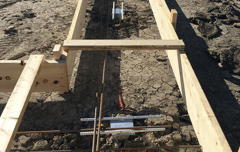 House foundation with helical piles before pouring concret